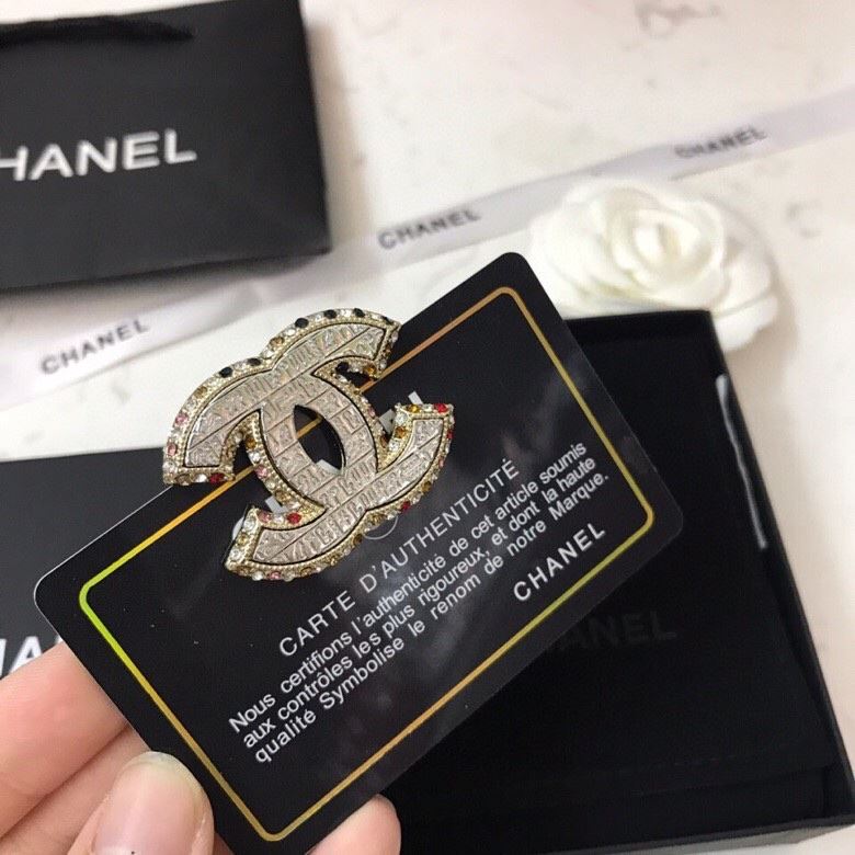 Ch**el brooches